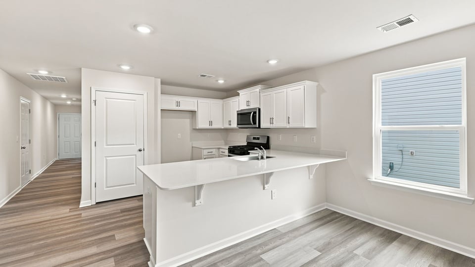Kitchen with stainless steel appliances.