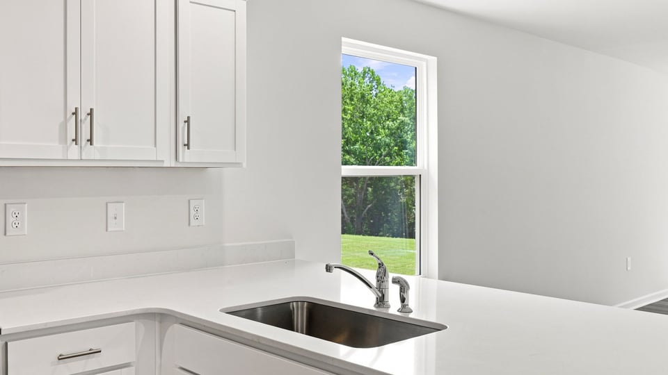 Kitchen with stainless steel appliances.