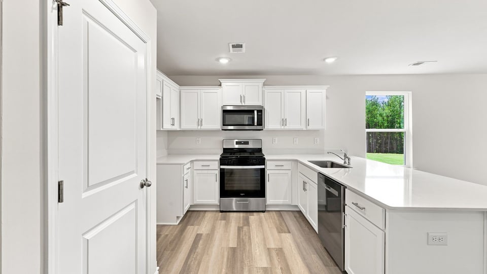 Kitchen with stainless steel appliances.