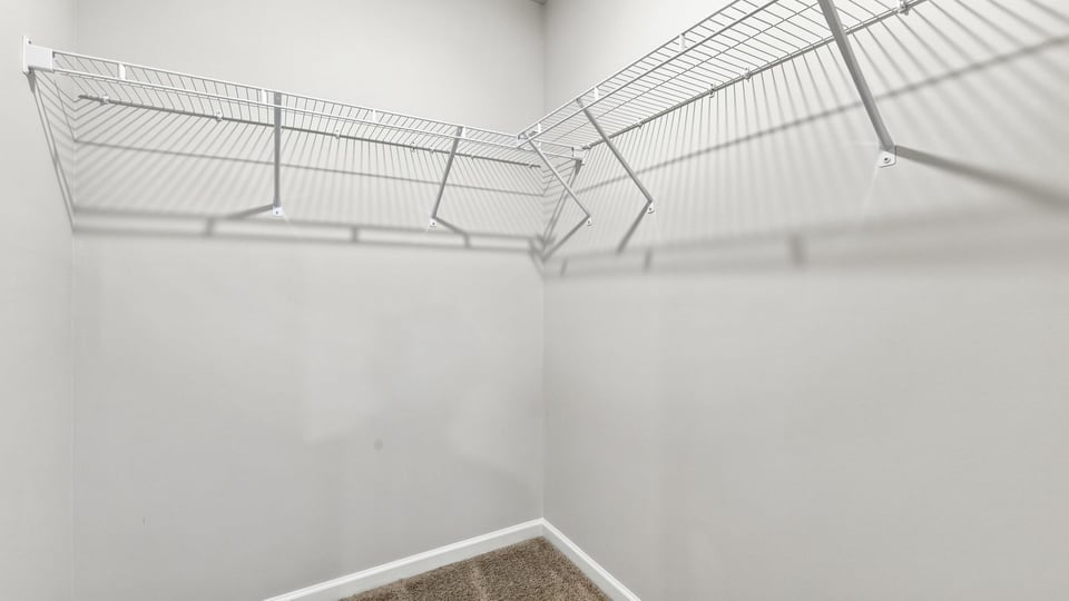 Closet with hanging storage racks.