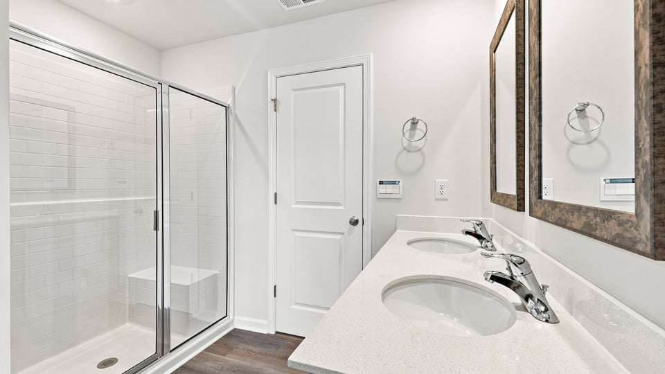 Bathroom with walk in shower.