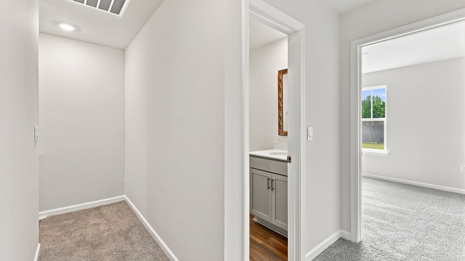 Closet with carpet.