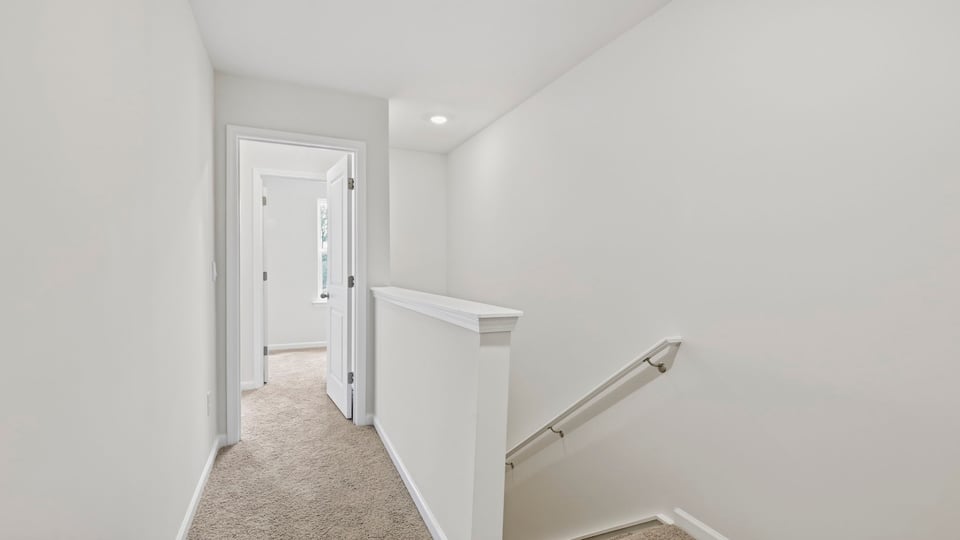 Loft area with carpet.
