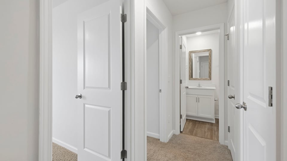 Loft area with carpet.