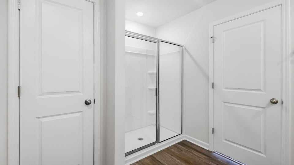 Bathroom with walk in shower.