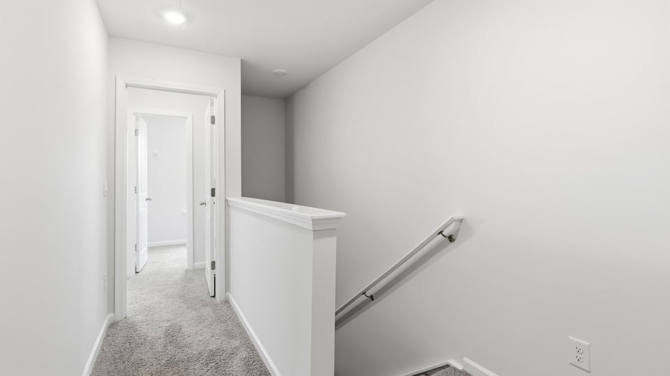 Loft area with carpet.