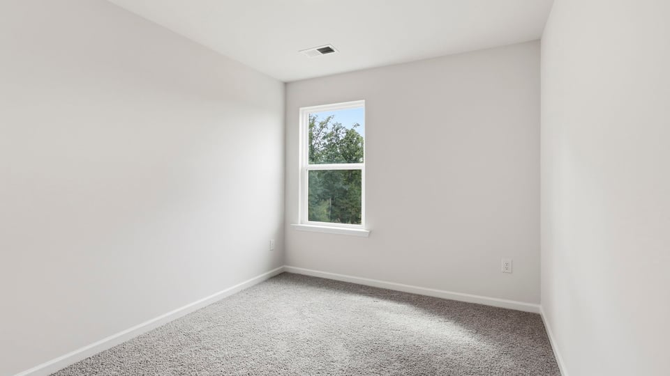 Bedroom with carpet and bedroom.