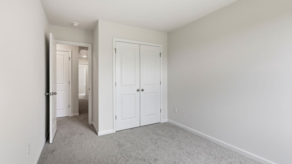 Bedroom with carpet and bedroom.