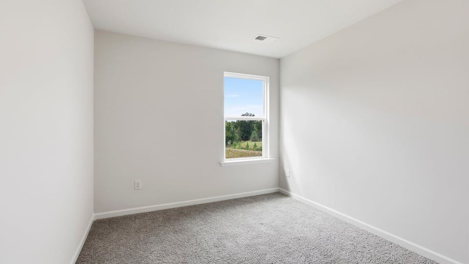 Bedroom with carpet and bedroom.
