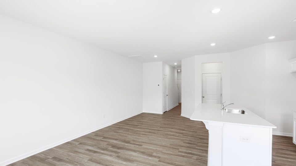 Kitchen and island with quartz countertops.