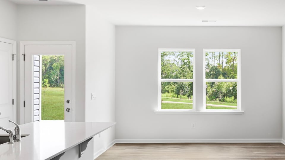 Kitchen and island with quartz countertops.
