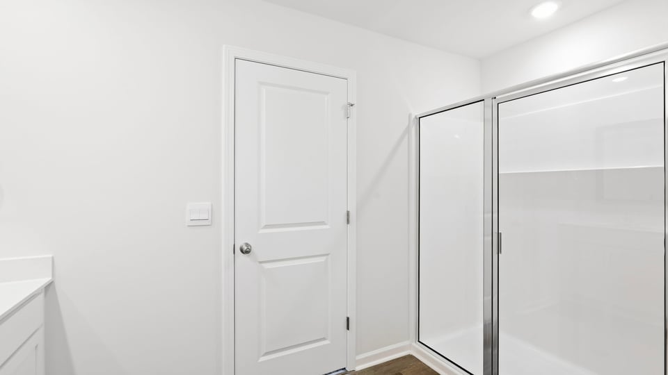 Bathroom with walk in shower.