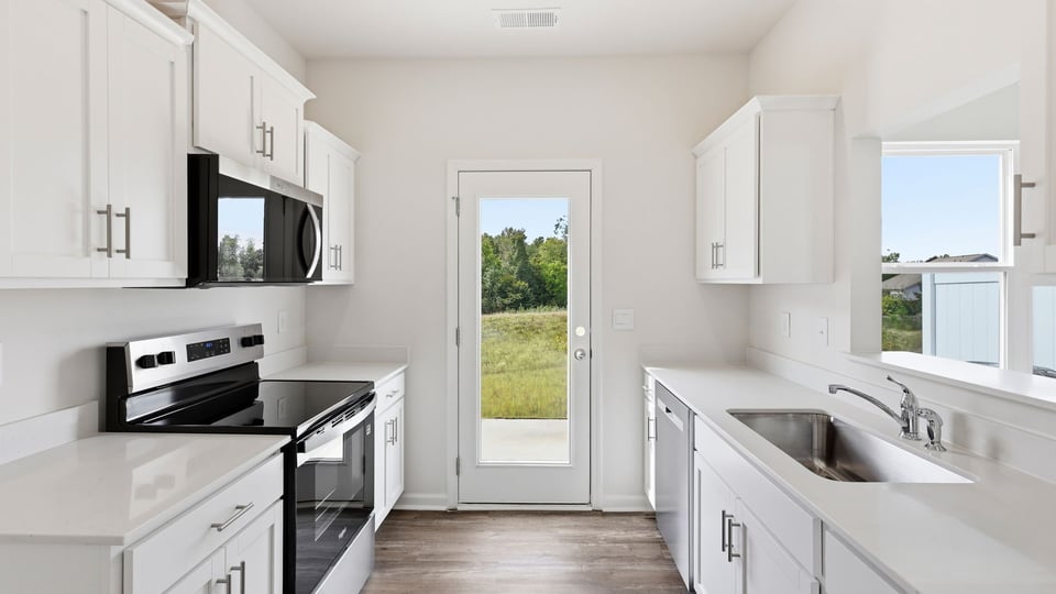 Kitchen with stainless steel appliances.