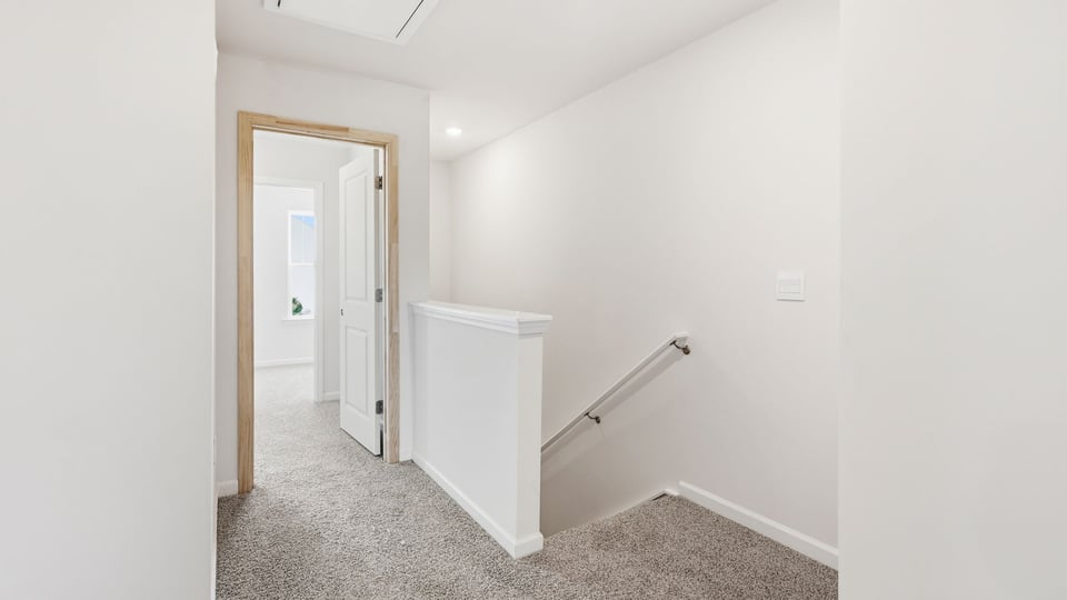Loft area with carpet.