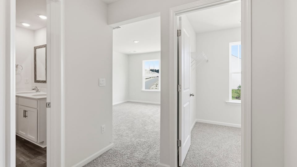 Hallway view of bedrooms.
