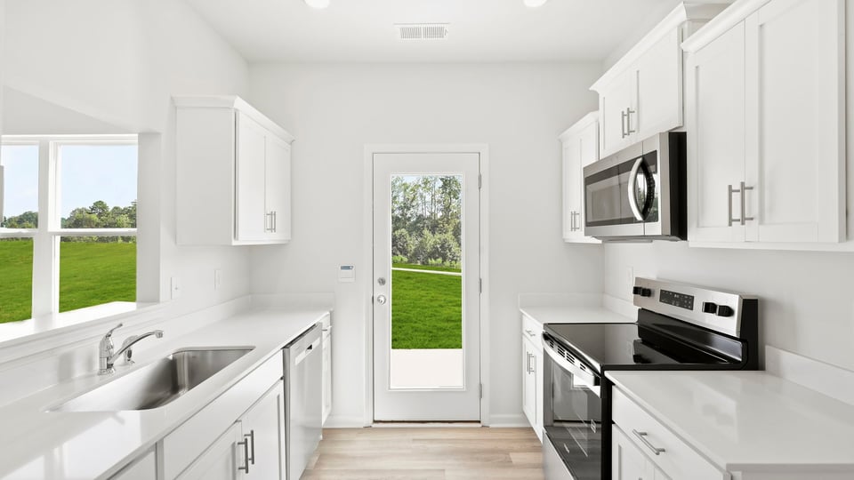 Kitchen with stainless steel appliances.
