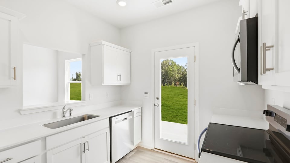 Kitchen with stainless steel appliances.