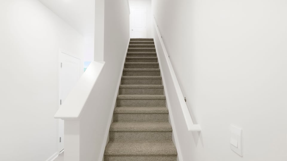 View of stairs to bedroom.