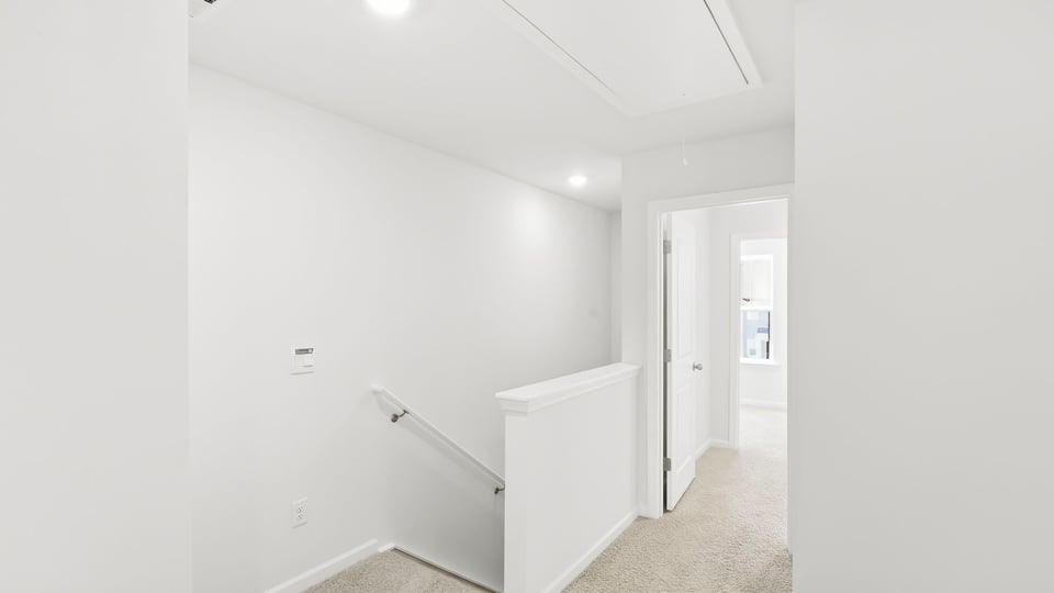 Loft area with carpet.