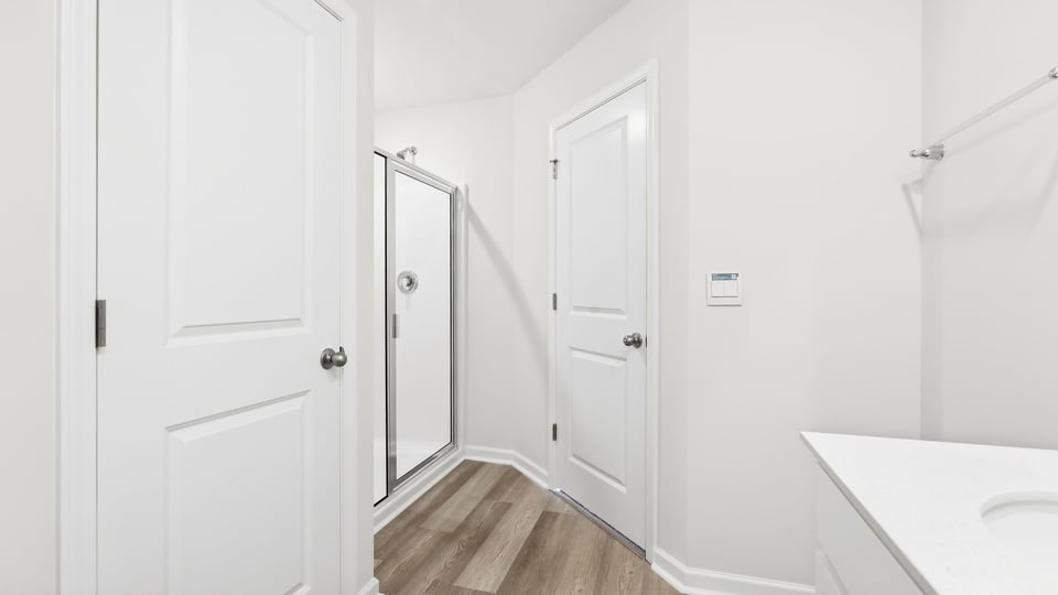 Bathroom with walk in shower.