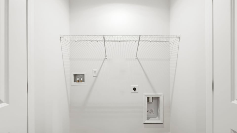 Laundry room with hanging storage racks.
