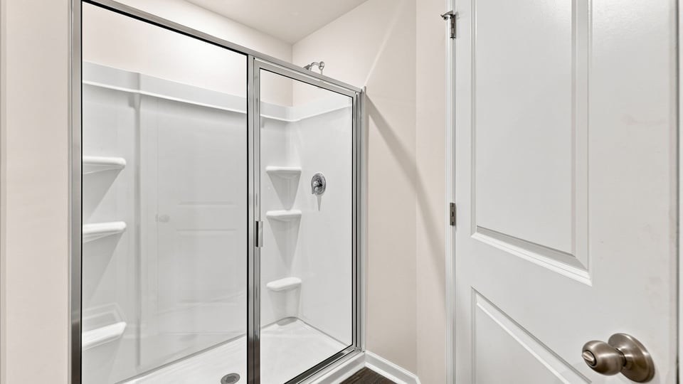 Bathroom with walk in shower.