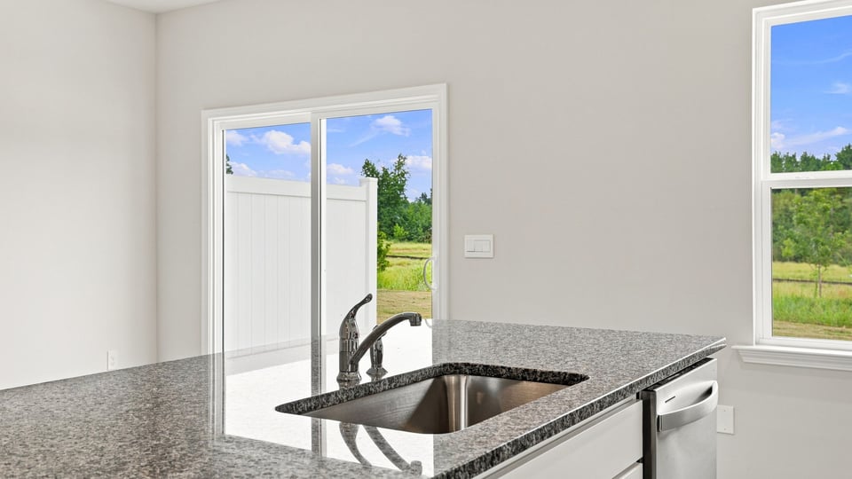 Kitchen with island and cabinets.