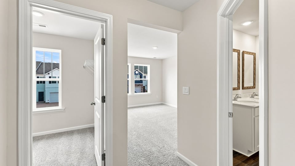 Bedroom with carpet and windows.v