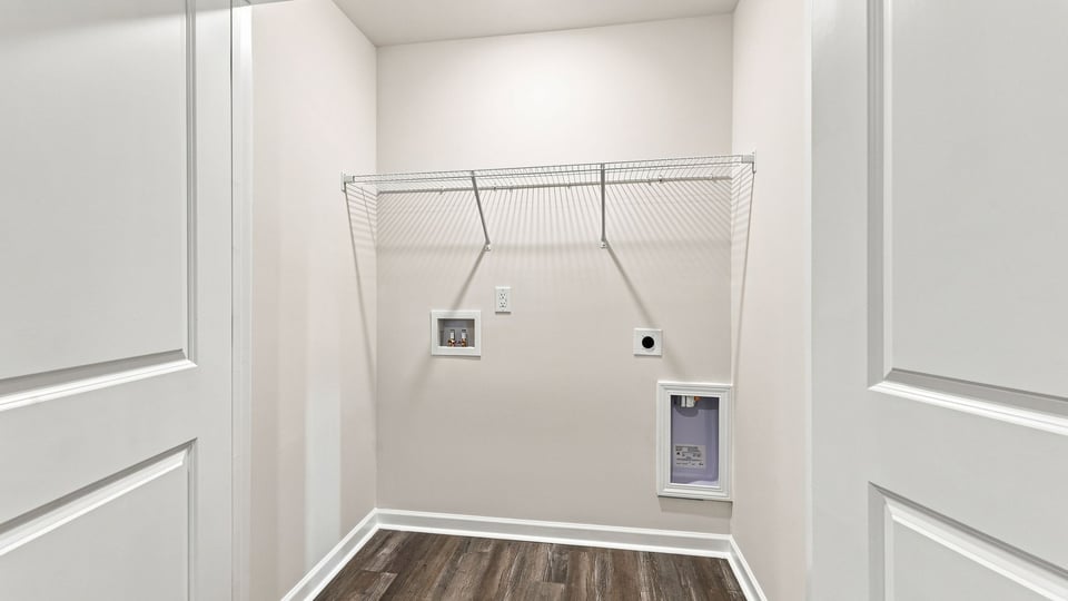 Laundry room with shelf.