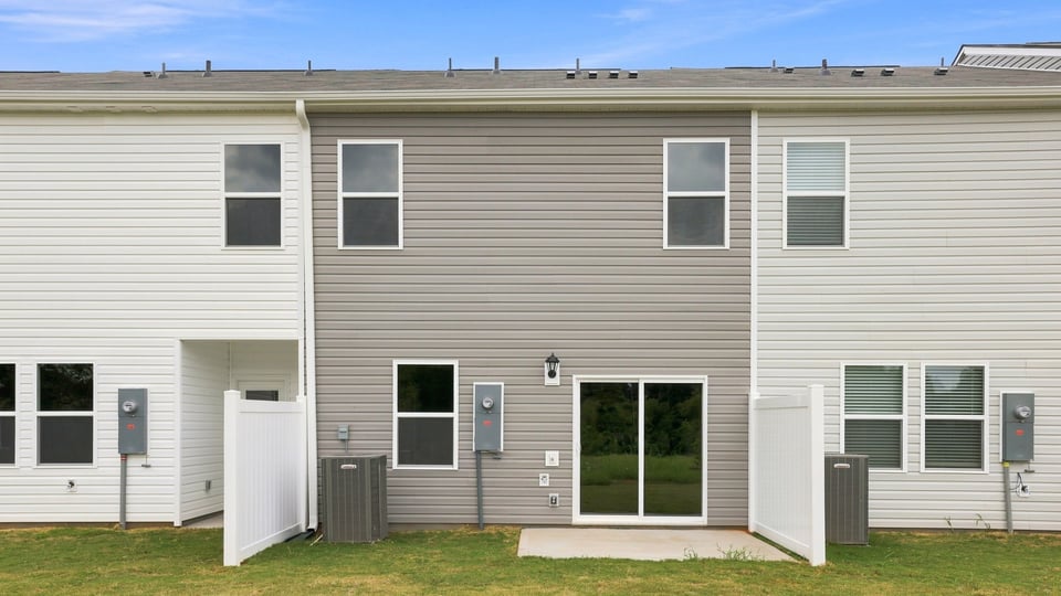 Back exterior with large backyard.