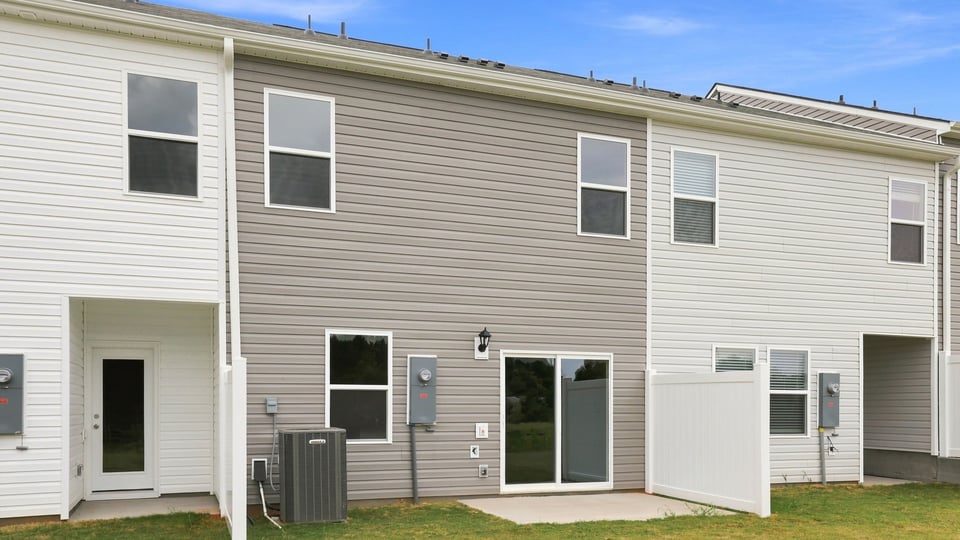 Back exterior with large backyard.