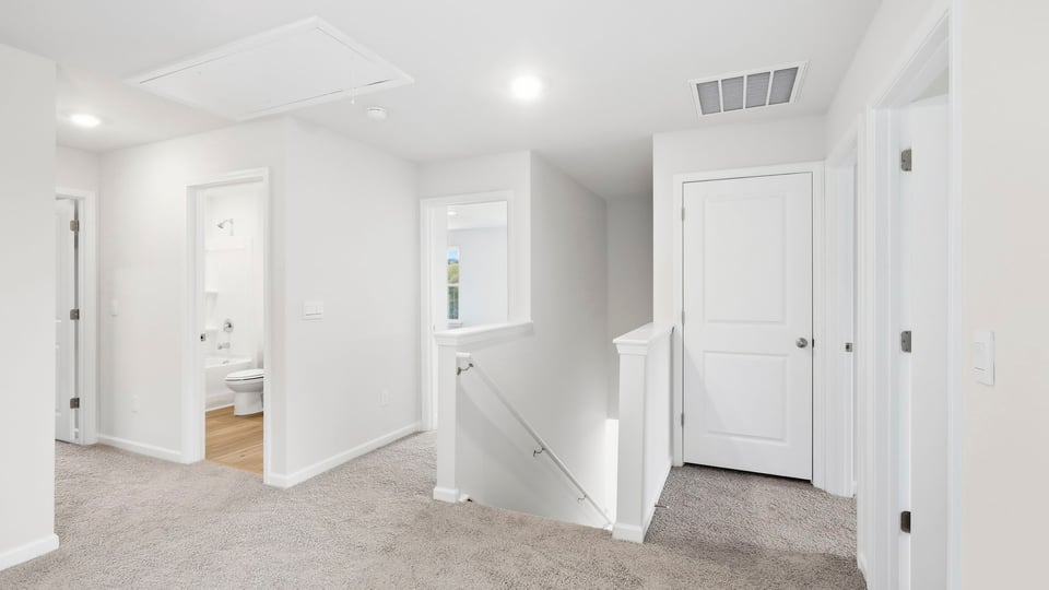 Loft area with carpet.