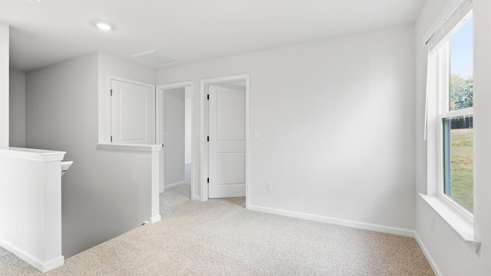 Loft area with carpet.