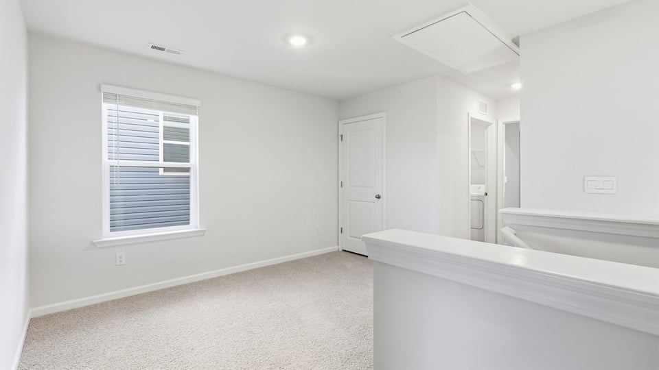Loft area with carpet.