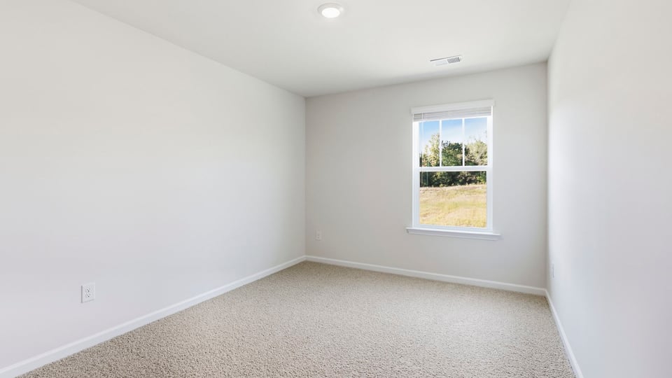 Bedroom with carpet and bedroom.