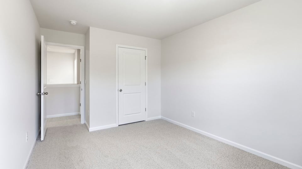 Bedroom with carpet and bedroom.