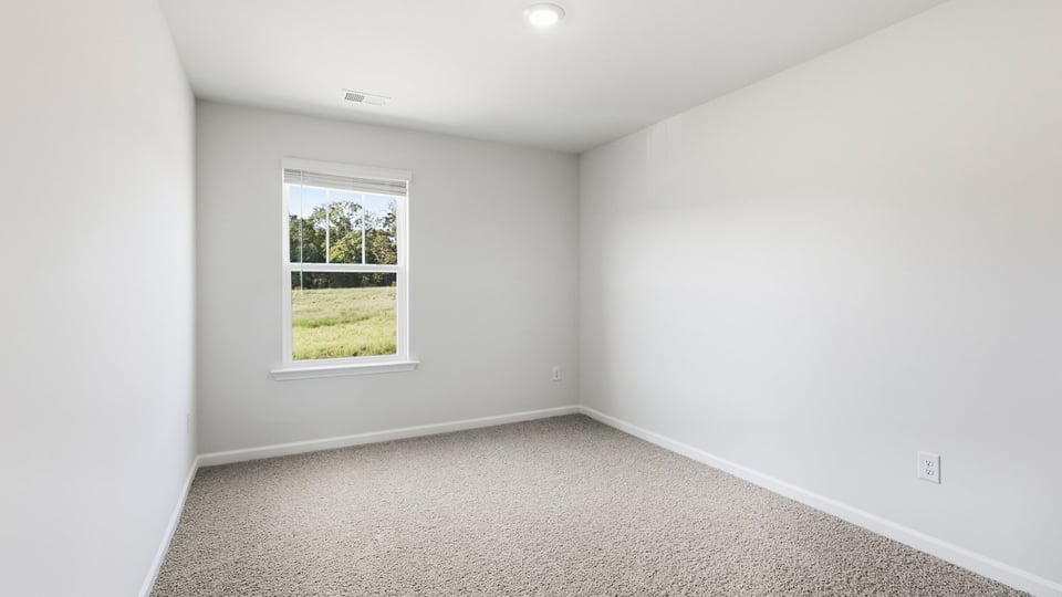 Bedroom with carpet and bedroom.
