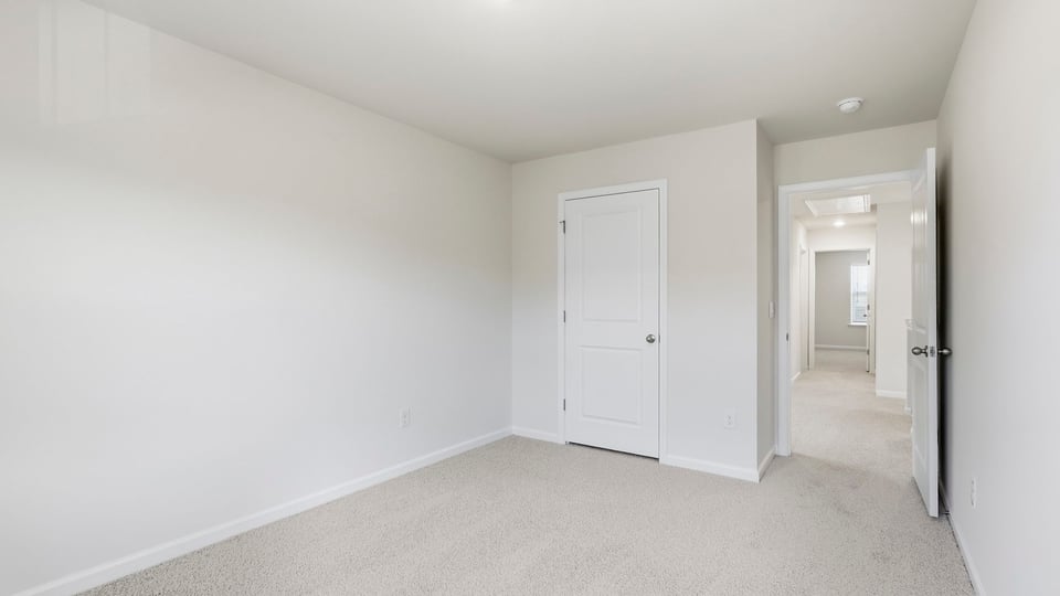 Bedroom with carpet and bedroom.