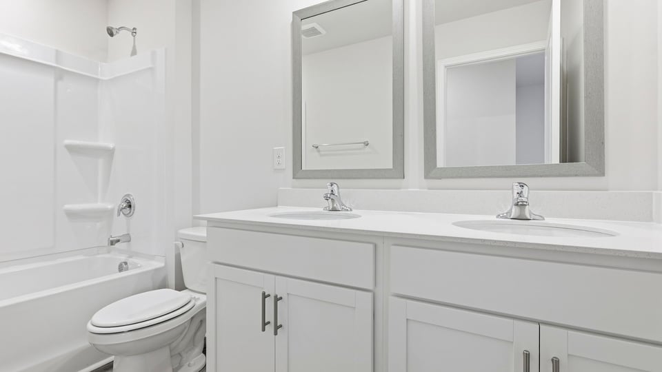 Bathroom with double single vanity sink.