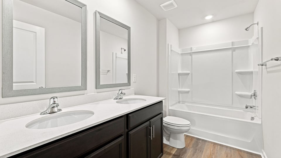 Bathroom with single vanity sink and bathtub.