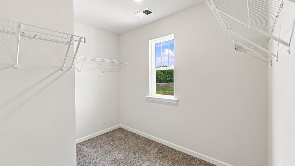 Closet with hanging storage racks.