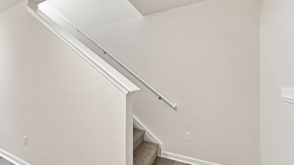 View of stairs to bedroom.