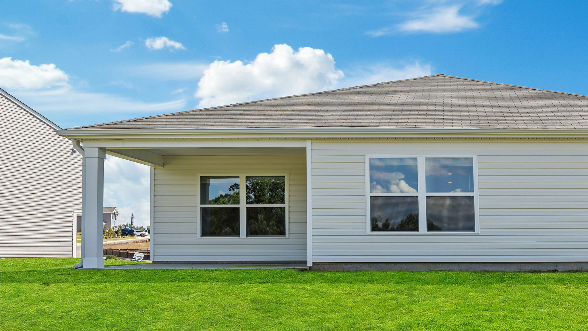 Exterior of home with large backyard.