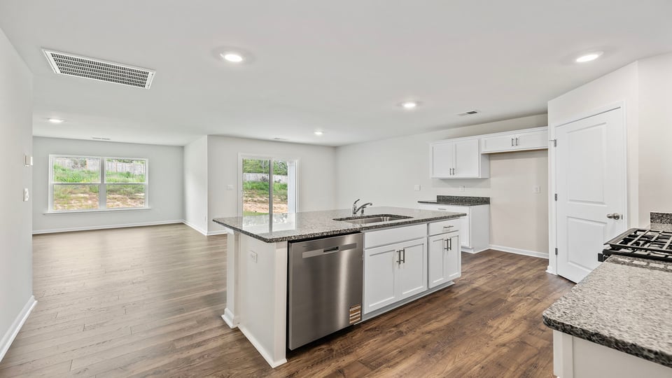 Kitchen with island and countertops.