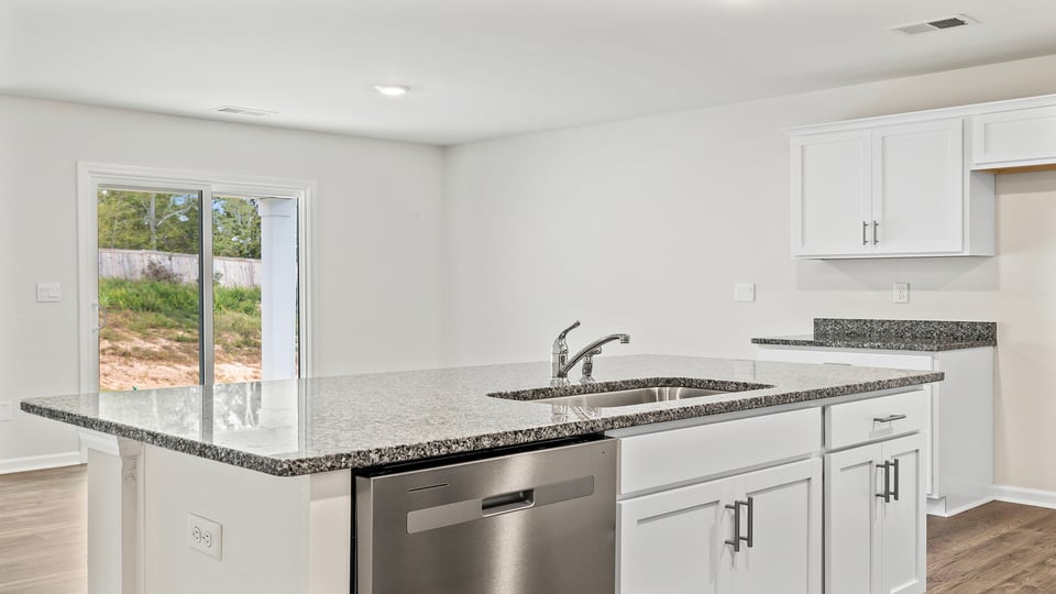 Kitchen with island and countertops.