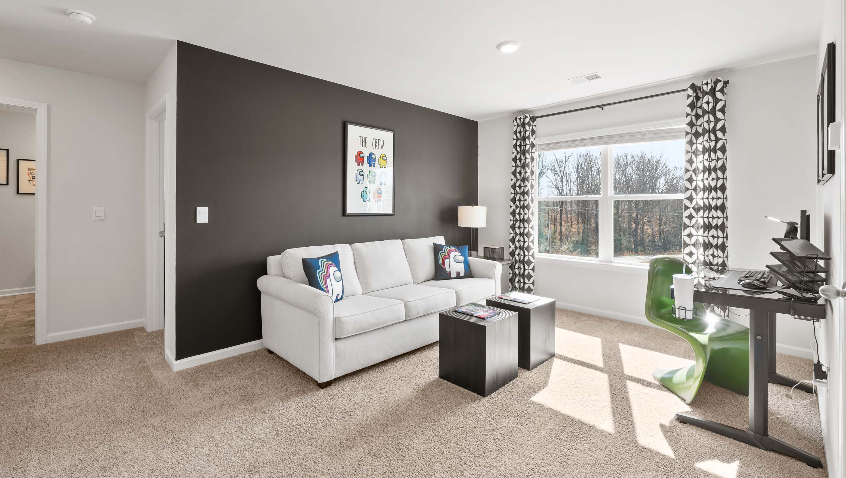 Loft area with carpet and window.