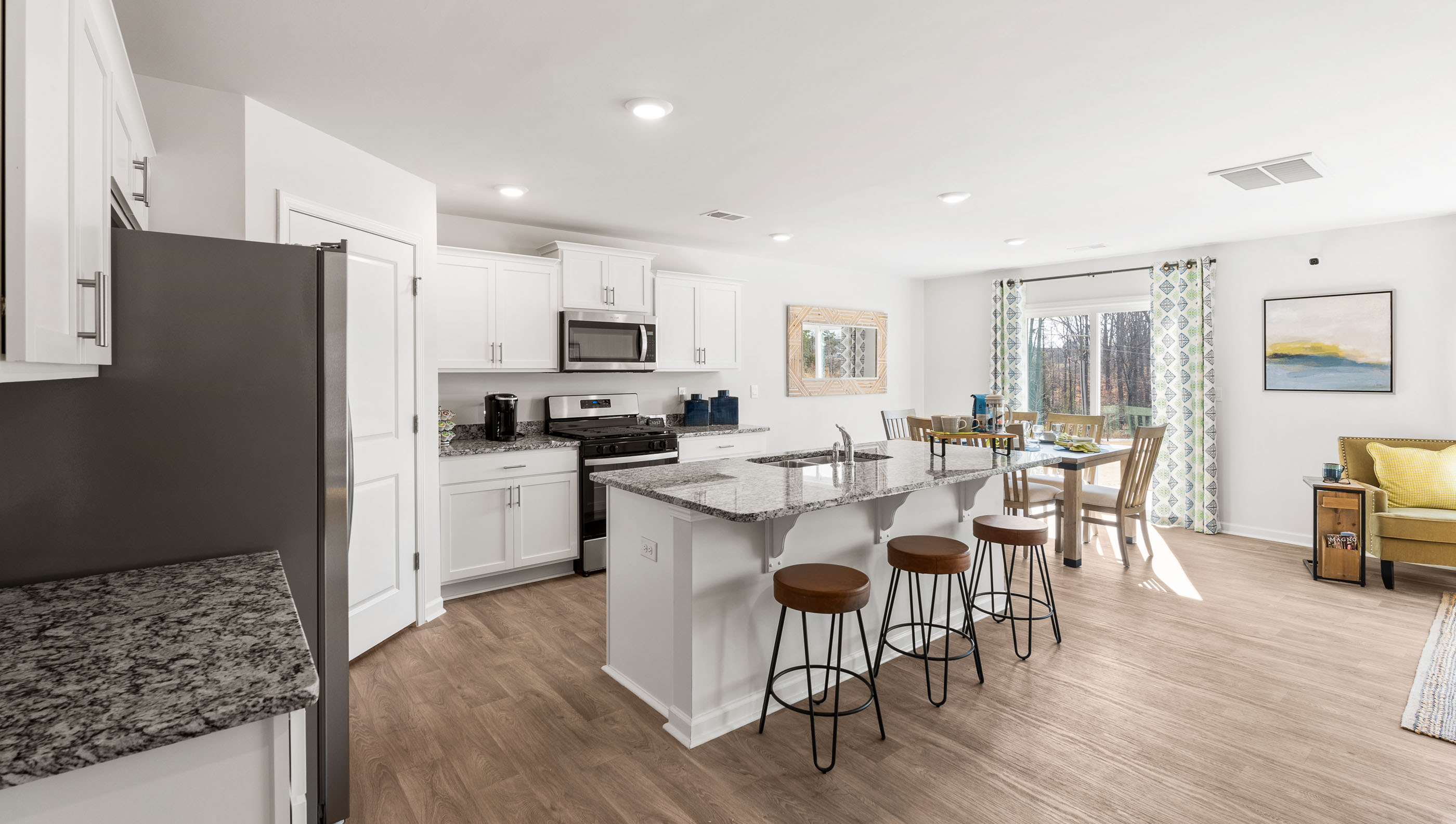 Kitchen and island with quartz countertops.