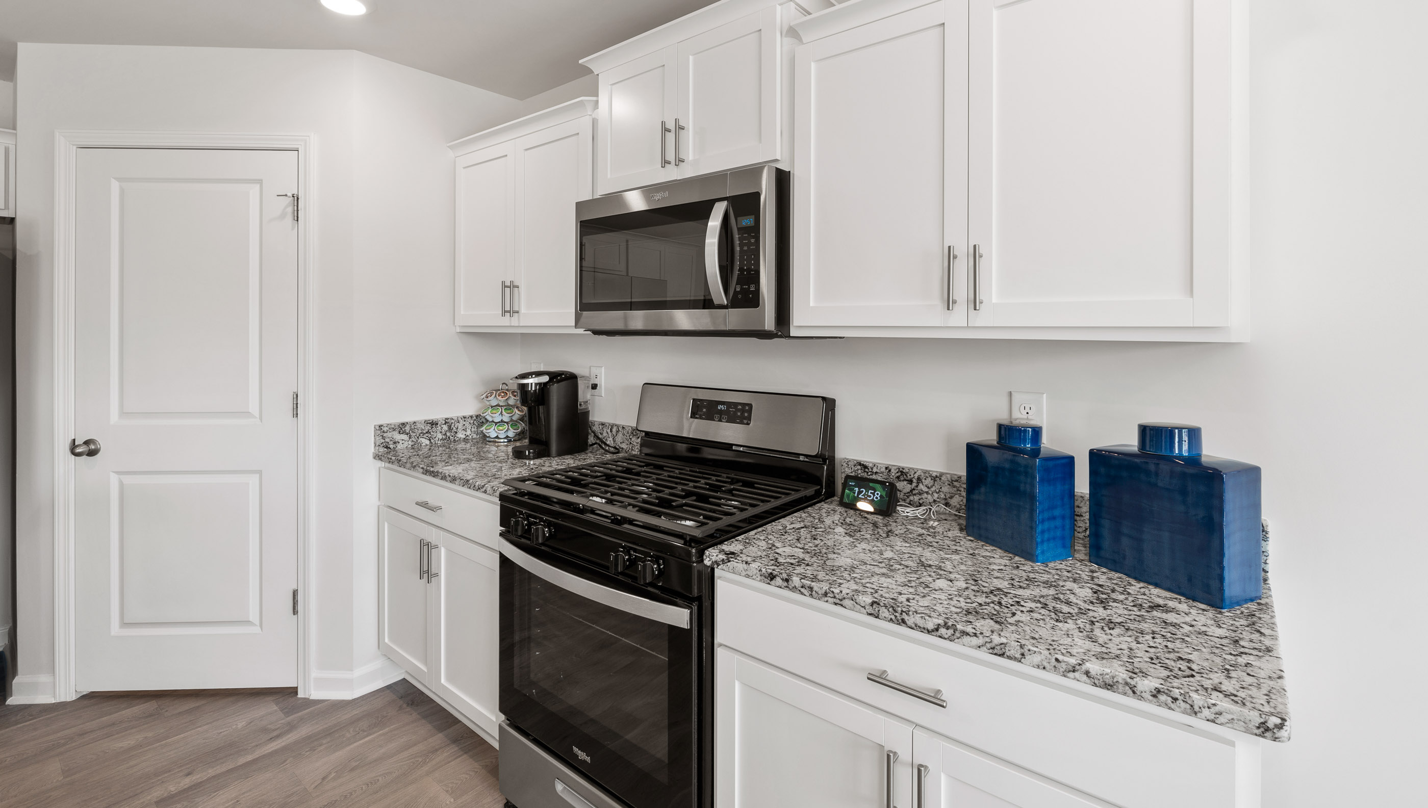 Kitchen and island with quartz countertops.
