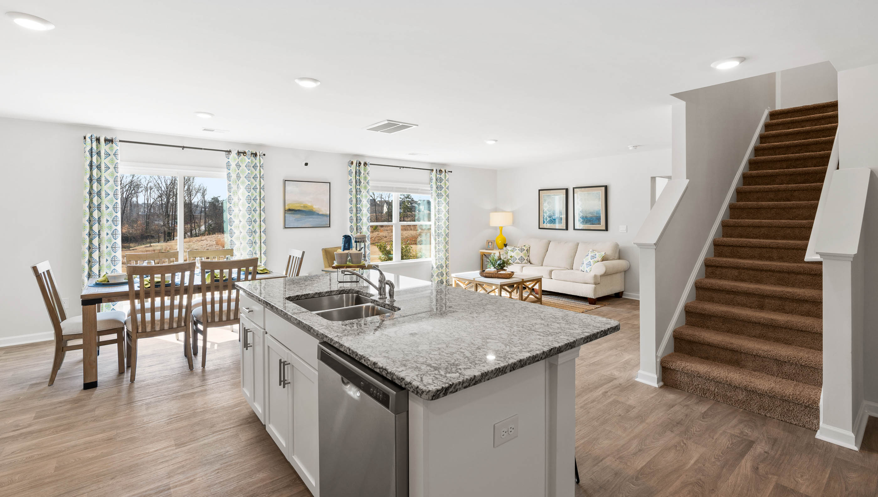 Kitchen and island with quartz countertops.