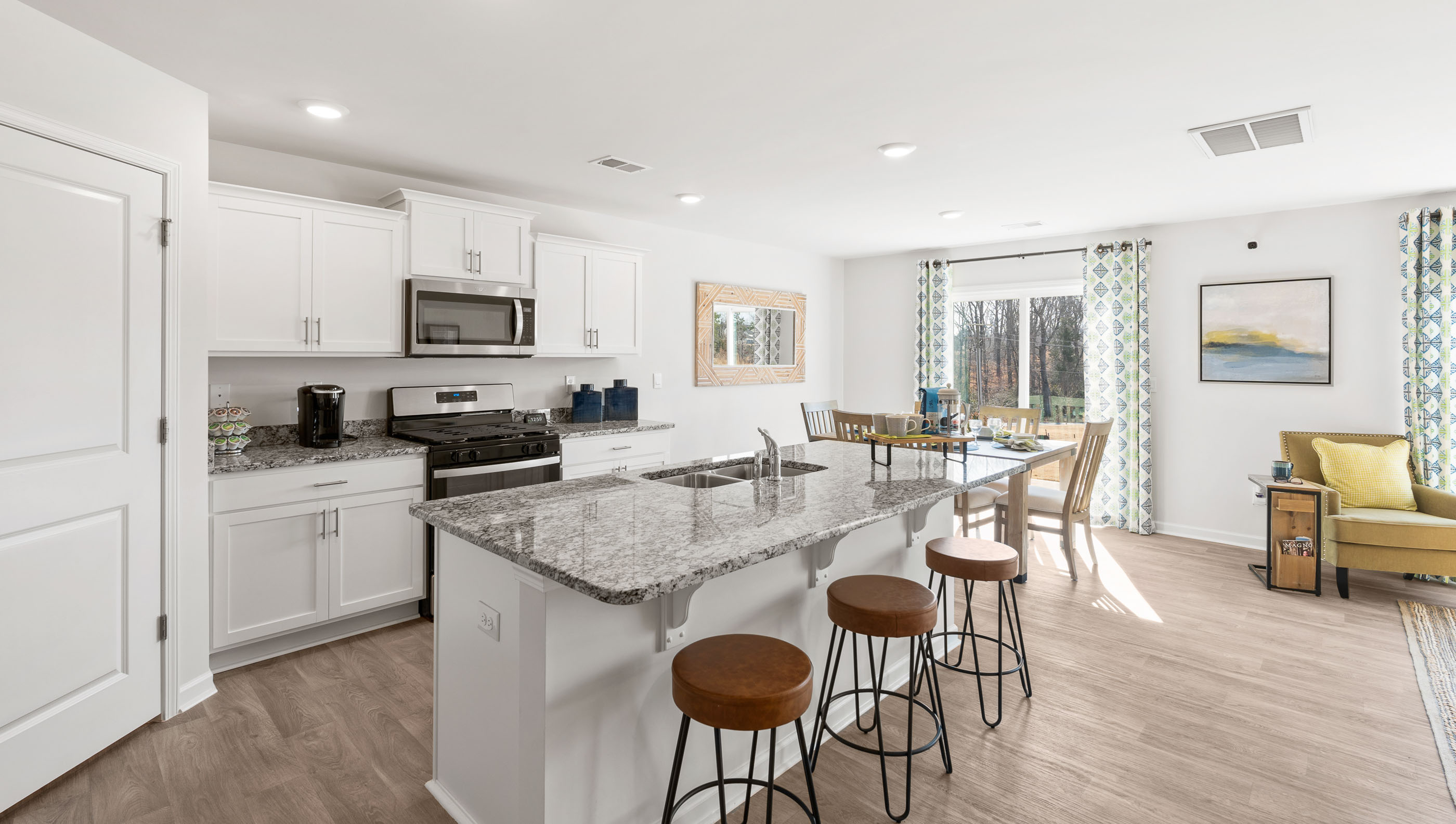 Kitchen and island with quartz countertops.